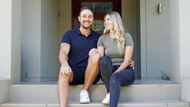 Daniel Walsh, with wife Sophie, bought 13 homes while he worked as a train driver. Picture: Tim Hunter