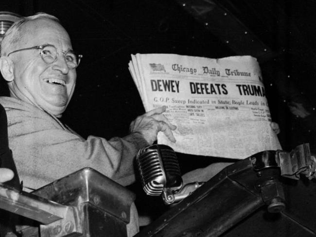 US President Harry S Truman holds up a copy of an election day Chicago Tribune, which, based on early election night results, mistakenly announced ‘Dewey Defeats Truman’ in 1948. The president told a crowd: 'That is one for the books!'