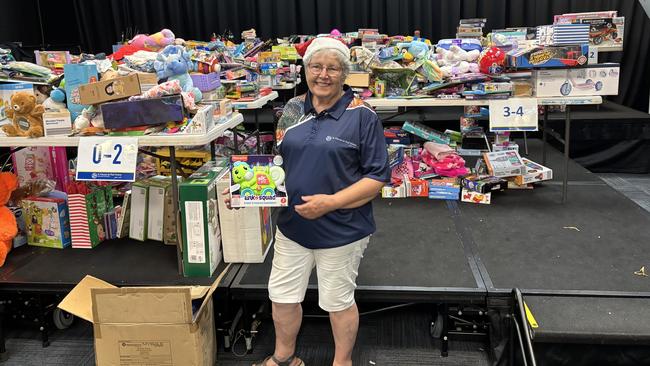 Volunteer Kay Fitzpatrick preparing for St Vincent de Paul Society NT's annual hamper project.