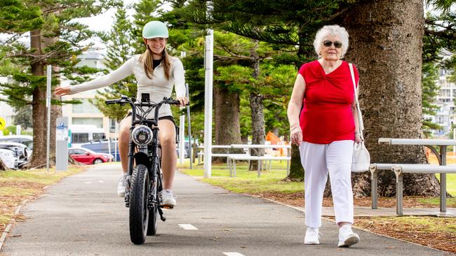 An image from the "E Bike – Know The Code" campaign by Northern Beaches Council, launched on Monday, showing that riders had to be careful on paths shared with pedestrians. Picture: Salty Dingo