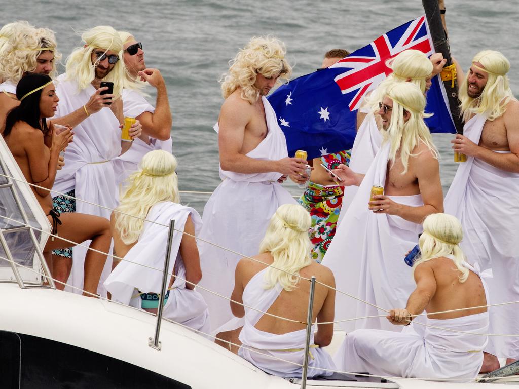 Highly decorated boats and people spending Australia Day on Sydney Harbour. Picture: Jenny Evans