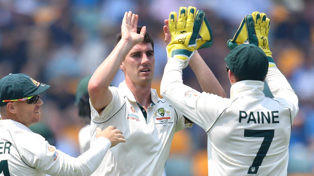 Pat Cummins celebrates a wicket with Tim Paine. If he is handed the top job he is going to need help at the top.