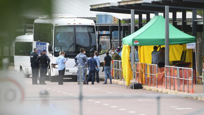 Evacuees from the <i>Diamond Princess</i> cruise ship arrive at the former Inpex workers’ camp where they will spend the next 14 days in quarantine. Picture: Che Chorley