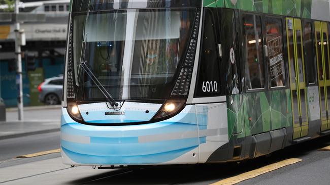 A tram in Collins Street with a blue painted mask. Picture: NCA NewsWire