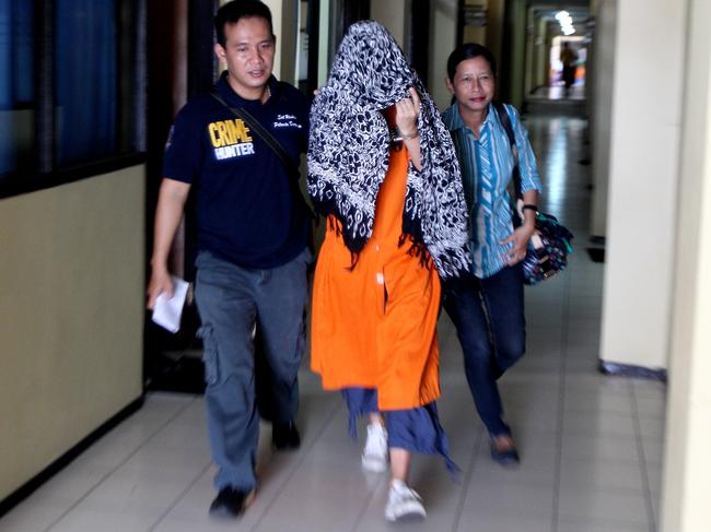 Police take Sara Connor for photograph and finger print identification to fulfill the dossier in Denpasar Police station. Sara and David were arrested as suspected involved on Police murder in Kuta beach Must credit Lukman S Bintoro