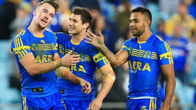 Clint Gutherson, Mitchell Moses and Bevan French enjoy a try.