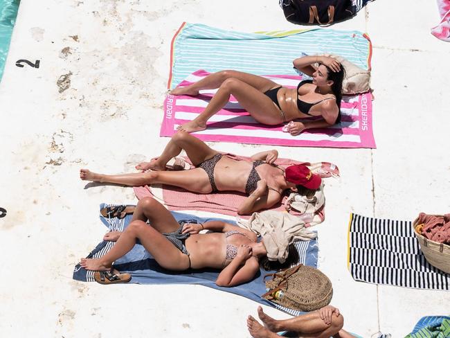 SYDNEY, AUSTRALIA - NewsWire Photos November 29, 2020: People sunbathing at the Bondi Icebergs swimming pool near Bondi Beach, Sydney. Picture: NCA NewsWire / James Gourley