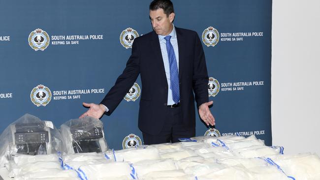 Detective Chief Inspector Darren Fielke with 50kg of methamphetamine that was seized. Picture: Naomi Jellicoe