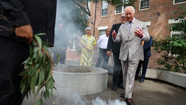 King Charles III takes part in a smoking ceremony during a visit to the National Centre for Indigenous Excellence on October 22 in Sydney. Picture: Pool/NewsWire