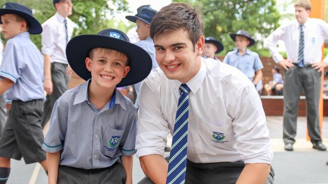 Ambrose Treacy College, Indooroopilly, school captain Thomas Perissonotto with a junior student