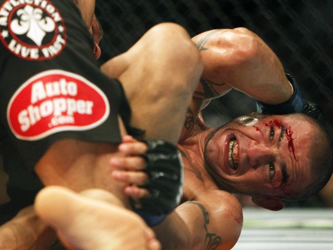 Cub Swanson reacts during his fight with Frankie Edgar in a featherweight mixed martial arts bout during the UFC Fight Night at the Frank Erwin Center in Austin, Texas, Sunday, Nov. 23, 2014. (AP Photo/Michael Thomas)