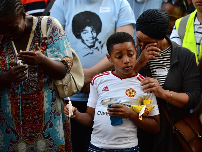 Mourners gather outside Notting Hill Methodist Church. Getty