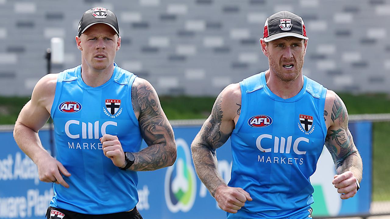 Zak Jones and Tim Membrey run laps. Picture: Ian Currie