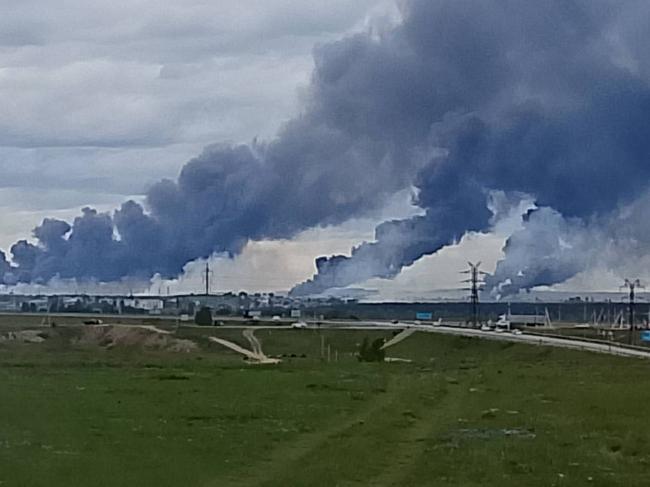 Columns of smoke rise from Russia's Belaya airbase located over 4000 kilometers from Ukraine. Drones  were used to destroy Russian bomber aircraft, were hidden in truck containers. Source - X