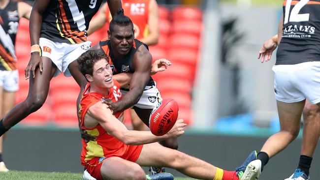 Gold Coast Bulletin only Please check with Picture Editor before use. Gold Coast Suns NEAFL elimination final against Northern Territory Thunder at Metricon Stadium. Photo of Daniel Charlesworth tackled. Photo by Richard Gosling