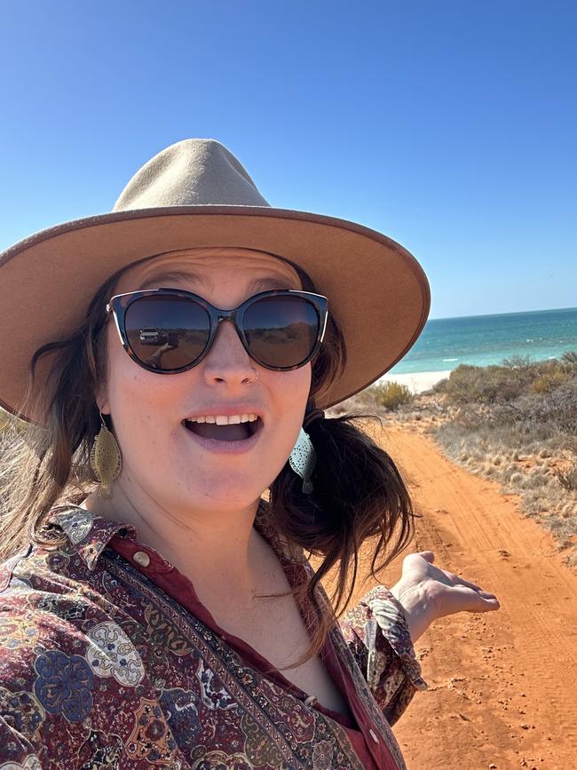 Zoe Kean searching for stromatolites at Gutharragudu/Shark Bay in Western Australia, a place where red desert sand meets the sea.