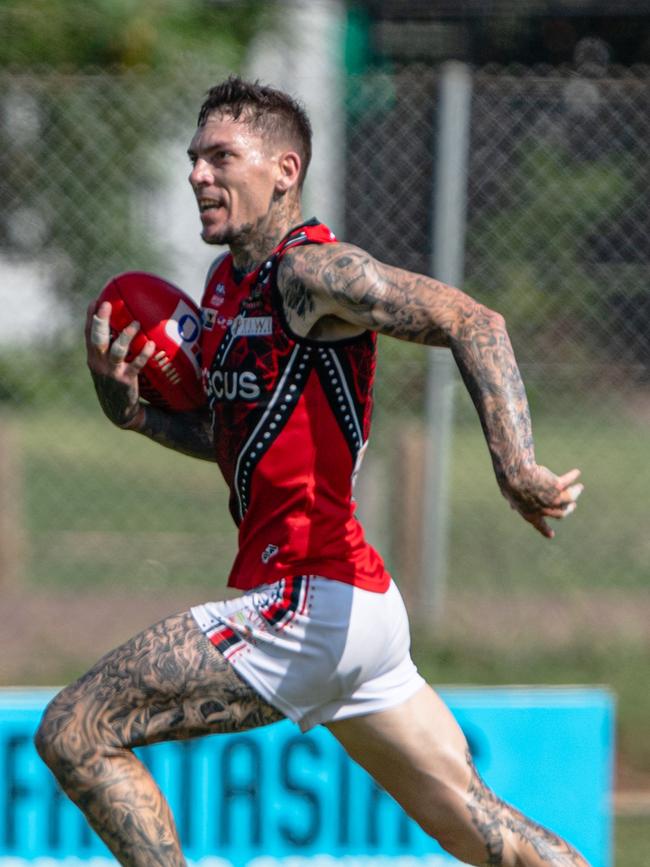 Parker bursts forward for the Tiwi Bombers. Picture: Pema Tamang Pakhrin