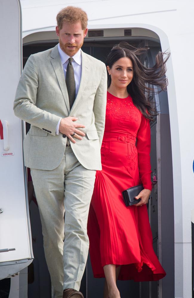 Suits him! Prince Harry, left, is ready for his close-up. Picture: Getty Images