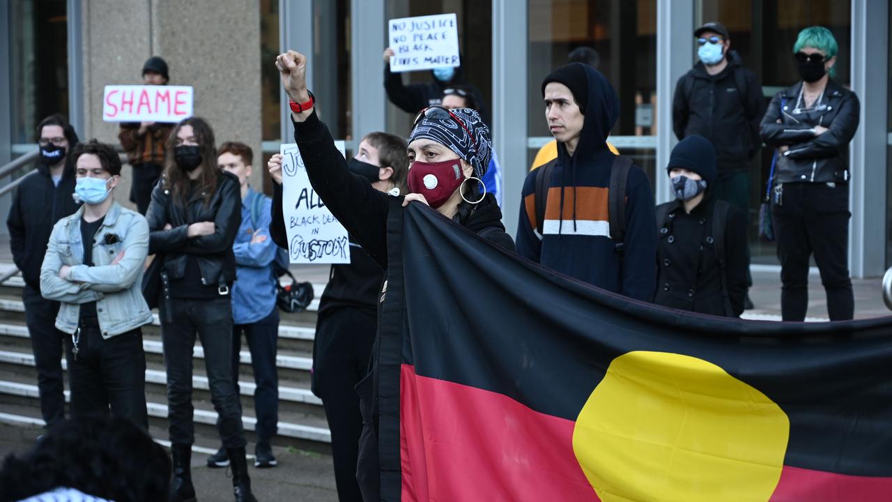 Protesters stand outside the Supreme Court in Sydney. Picture: AFP/Peter Parks