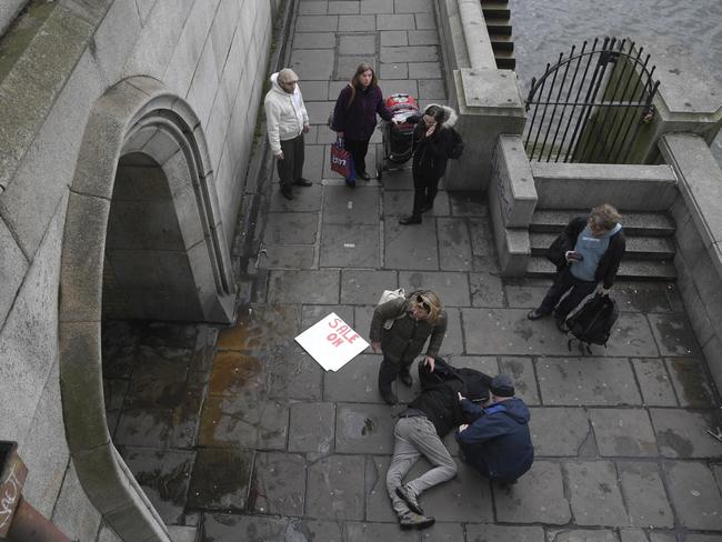 One man was sent crashing down concrete stairs and was knocked unconscious. Picture: Reuters