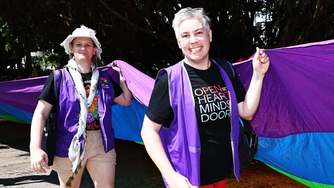 A group of LGBTIQA+SB people and supporters paraded along the Cairns Esplanade with a huge rainbow flag for the Pride Stride, part of the Cairns Pride Festival, on Saturday. Billie Stimpson and Jo Sampford hold a huge rainbow flag along the march. Picture: Brendan Radke