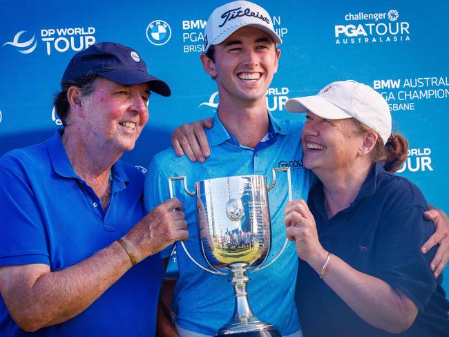 Elvis Smylie of Australia (C) with parents Peter (L) and Liz (R). Picture: Patrick Hamilton/AFP