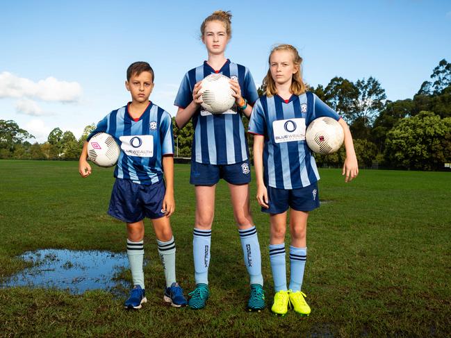 Drainage concerns at Carlingford sporting ovals, where Roselea FC players Adam Ilic, Alessandra Primrose and Isabella Primrose are standing. Picture: Jordan Shields