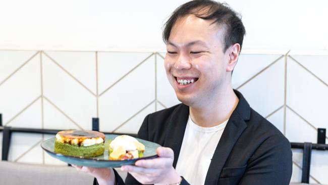 Isaac Lai gets ready to blog about matcha brulee pancakes, one of his go-to dishes at Koku Culture, Ashfield. Picture: Monique Harmer