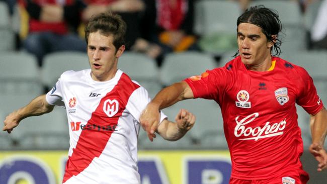 Francisco “Pancho” Usucar during his Adelaide United days facing another ex Red Mate Dugandzic of Melbourne Heart (City).