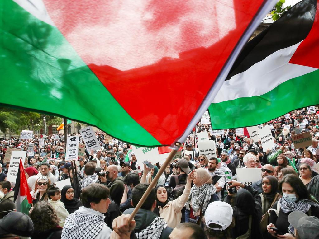 People participate in a rally against the occupation of Palestine and the conflict between Israel and Hamas in Melbourne CBD. Picture: David Crosling