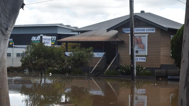 The flood water left a muddy mark on the roof of Oscar Bakos’ Uralba Street denture clinic.