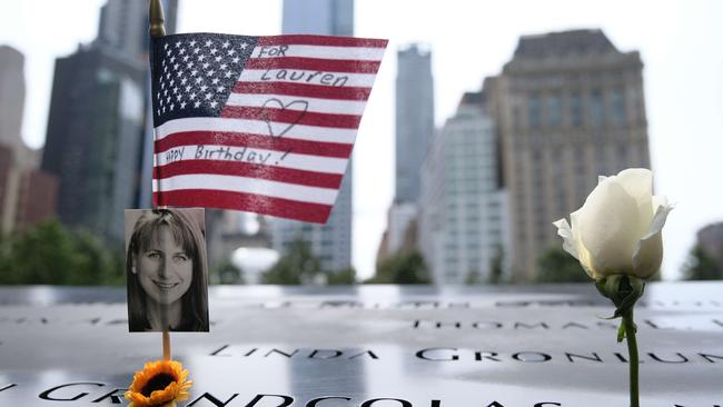 A US flag is placed near a victim's name at the September 11 memorial at Ground Zero in New York. Picture: AFP