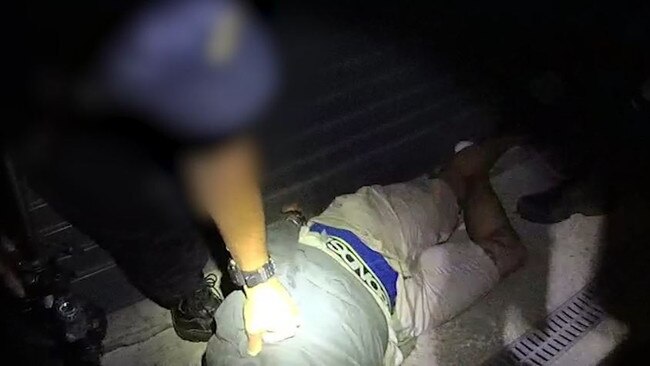 A suspect is arrested at Acacia Ridge in the early hours of December 13, 2021, after leading police on a wild chase through Brisbane's southside in a stolen vehicle brimming with guns, drugs and other contraband. Picture: QPS