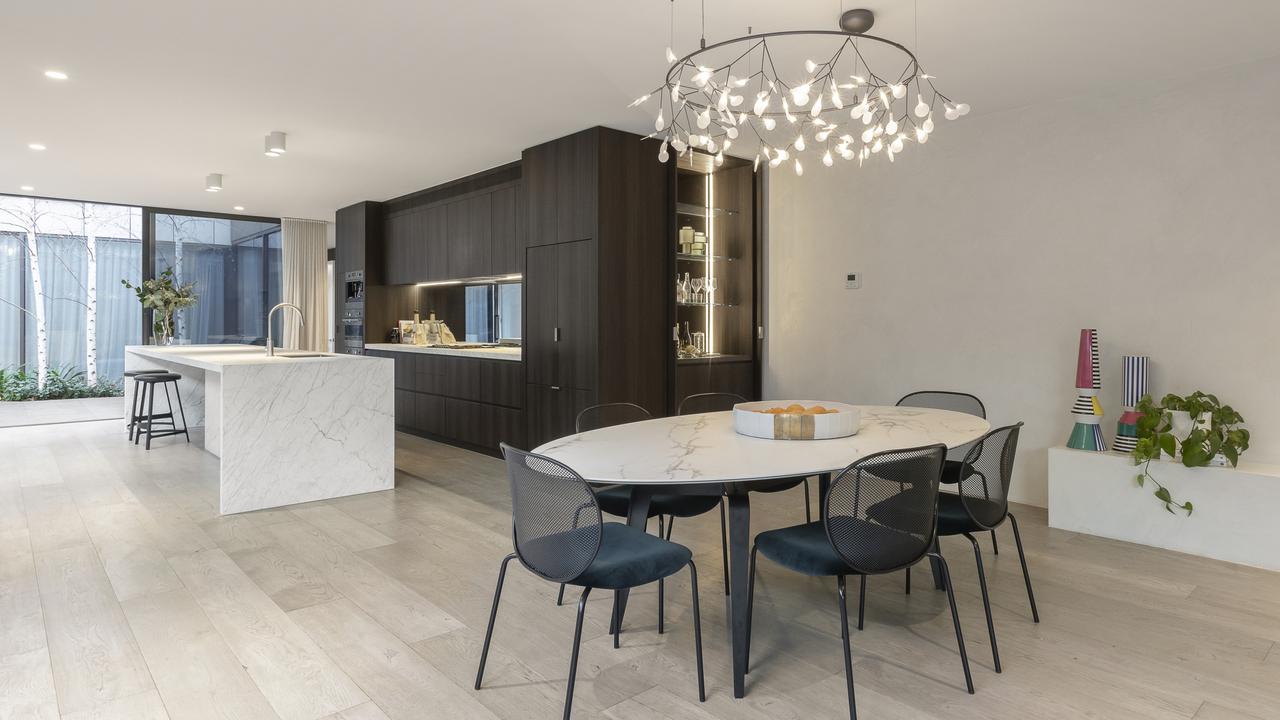 The kitchen is fitted with porcelain benchtops.