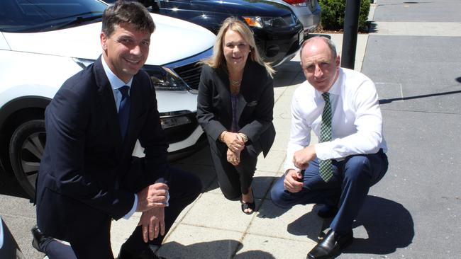 Angus Taylor, Cr Julie Greer and Luke Howarth discuss parking in The Corso at North Lakes. Photo: Alan Quinney