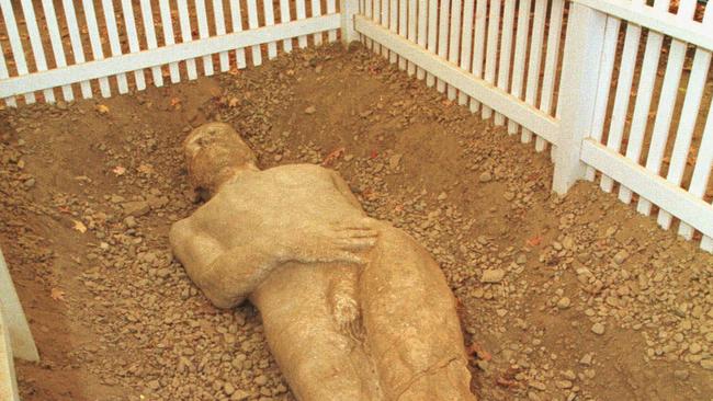 OCTOBER 1999 : Nicole Retzler, curator of exhibitions at the Farmers Museum in Cooperstown, New York, looks over the Cardiff Giant exhibit 10/99.USA