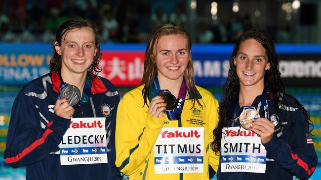 Gold medallist Australia's Ariarne Titmus (C), silver medallist USA's Katie Ledecky (L) and bronze medallist USA's Leah Smith pose with their medals after the final of the women's 400m freestyle event during the swimming competition at the 2019 World Championships at Nambu University Municipal Aquatics Center in Gwangju, South Korea, on July 21, 2019. (Photo by Oli SCARFF / AFP)