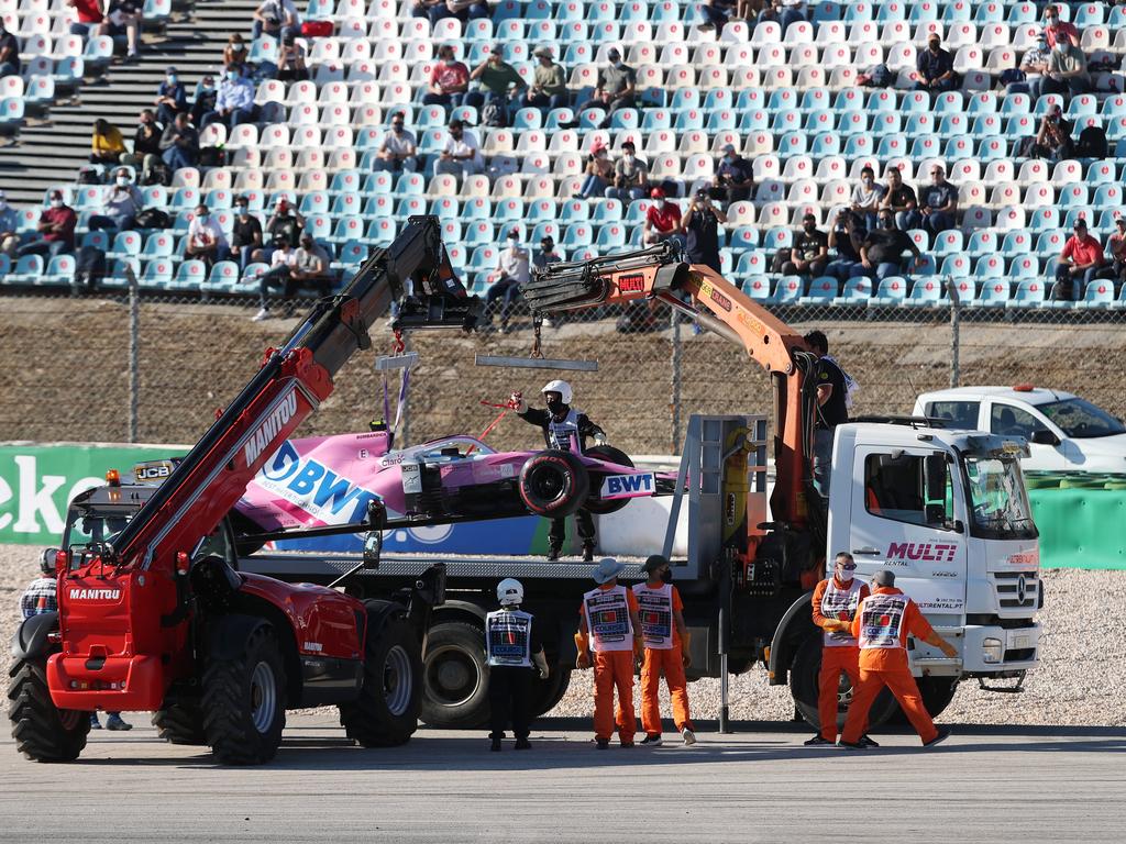 The car of Lance Stroll is removed from the track. (Photo by Jose Sena Goulao – Pool/Getty Images)