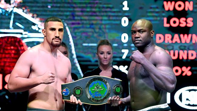 Justis Huni and Arsene Fosso with the Australian heavyweight belt. Picture: Bradley Kanaris/Getty