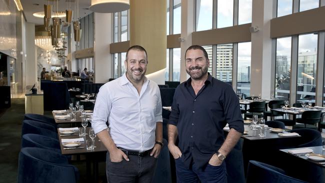 Partners in Nineteen at The Star, restaurateur Simon Gloftis (left) and Billy Cross at the rooftop venue on the top floor of The Darling luxury suite hotel at The Star Gold Coast. PICTURE: Remco Jansen