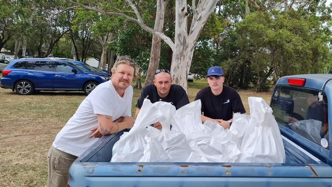 Matt Ranken from Kamaco Blinds (centre) filling up sandbags to protect the company's warehouse in Clontarf. Picture: NewsWire