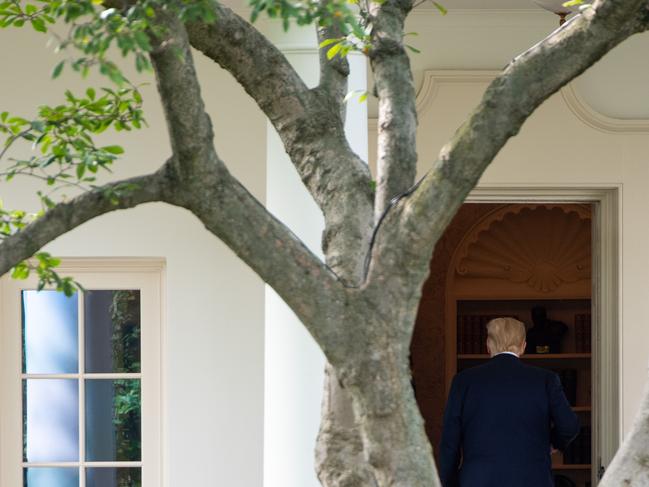 US President Donald Trump walks into the Oval Office prior to departing on Marine One from the South Lawn of the White House in Washington, DC, September 15, 2020, as he travels to Philadelphia, Pennsylvania for a town hall. - Israel normalized relations with long-time foes Bahrain and the United Arab Emirates at a White House ceremony on September 15, 2020 as President Donald Trump said similar US-brokered deals were close between the Jewish state and "five or six" other nations. (Photo by SAUL LOEB / AFP)