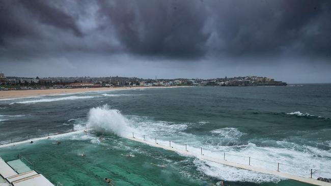 On Saturday morning, storm cloud brew north over the Bondi Baths and Icebergs club. Picture: Julian Andrews