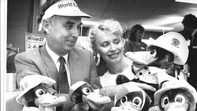 Expo chairman Sir Llew Edwards and model Karen Cameron with some of the Expo Oz souvenirs.