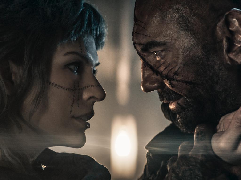 Milla Jovovich and Dave Bautista make a compelling couple in In the Lost Lands.