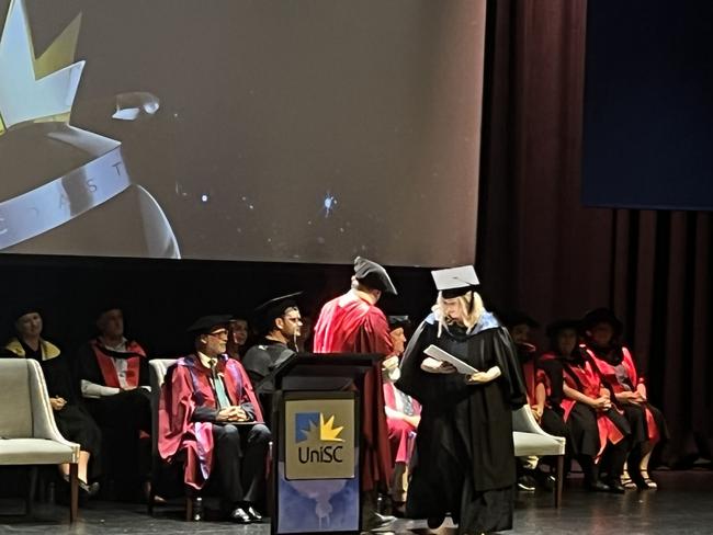 Graduates from the University of the Sunshine Coast's Fraser Coast campus celebrating at the Brolga Theatre.