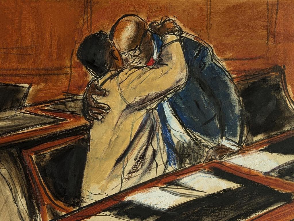 In this courtroom sketch, Sean "Diddy" Combs, left, upon entering the courtroom hugs his lawyer Anthony Ricco prior to the hearing in Federal court in New York. Picture: Elizabeth Williams via AP