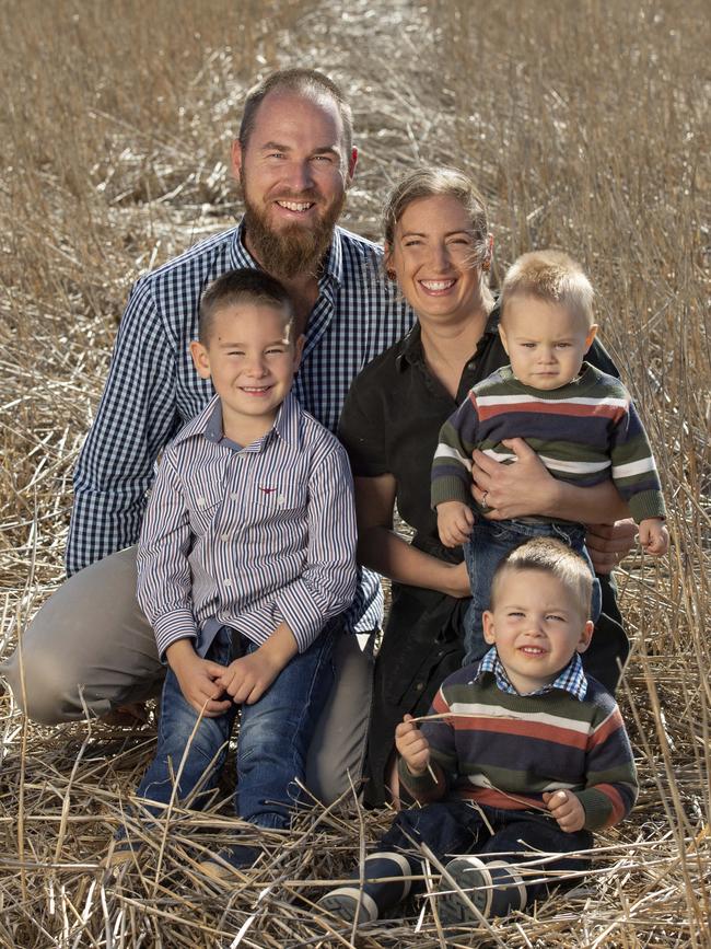 Teghan and Kyle Pearse with their kids: 5yo Jack, 2yo Ted and 10 month old Charlie and their Kelpie, Bel. Picture: Zoe Phillips