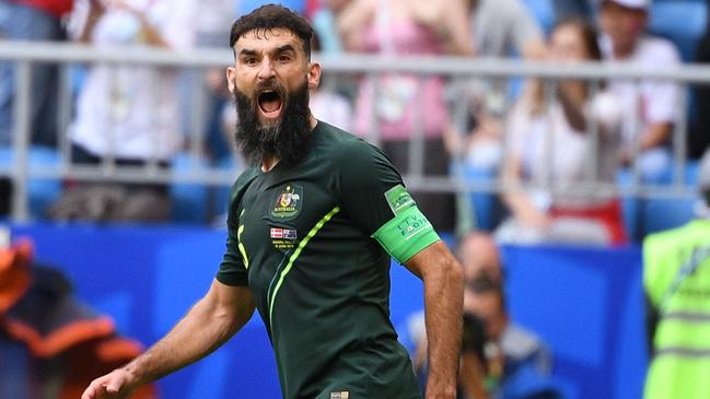 Mile Jedinak celebrates scoring from the penalty spot against Denmark in this year’s World Cup.