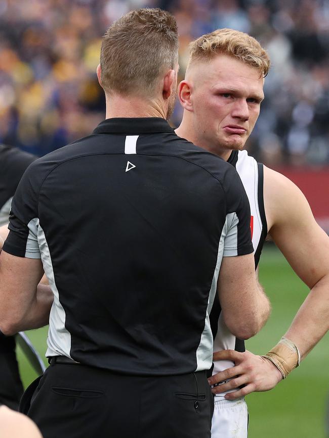Nathan Buckley consoles Adam Treloar after the 2018 Grand Final. Picture: Phil Hillyard